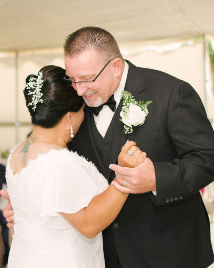 The older bride and groom share their first dance as Husband and Wife at Jess Jones Winery in Dixon CA